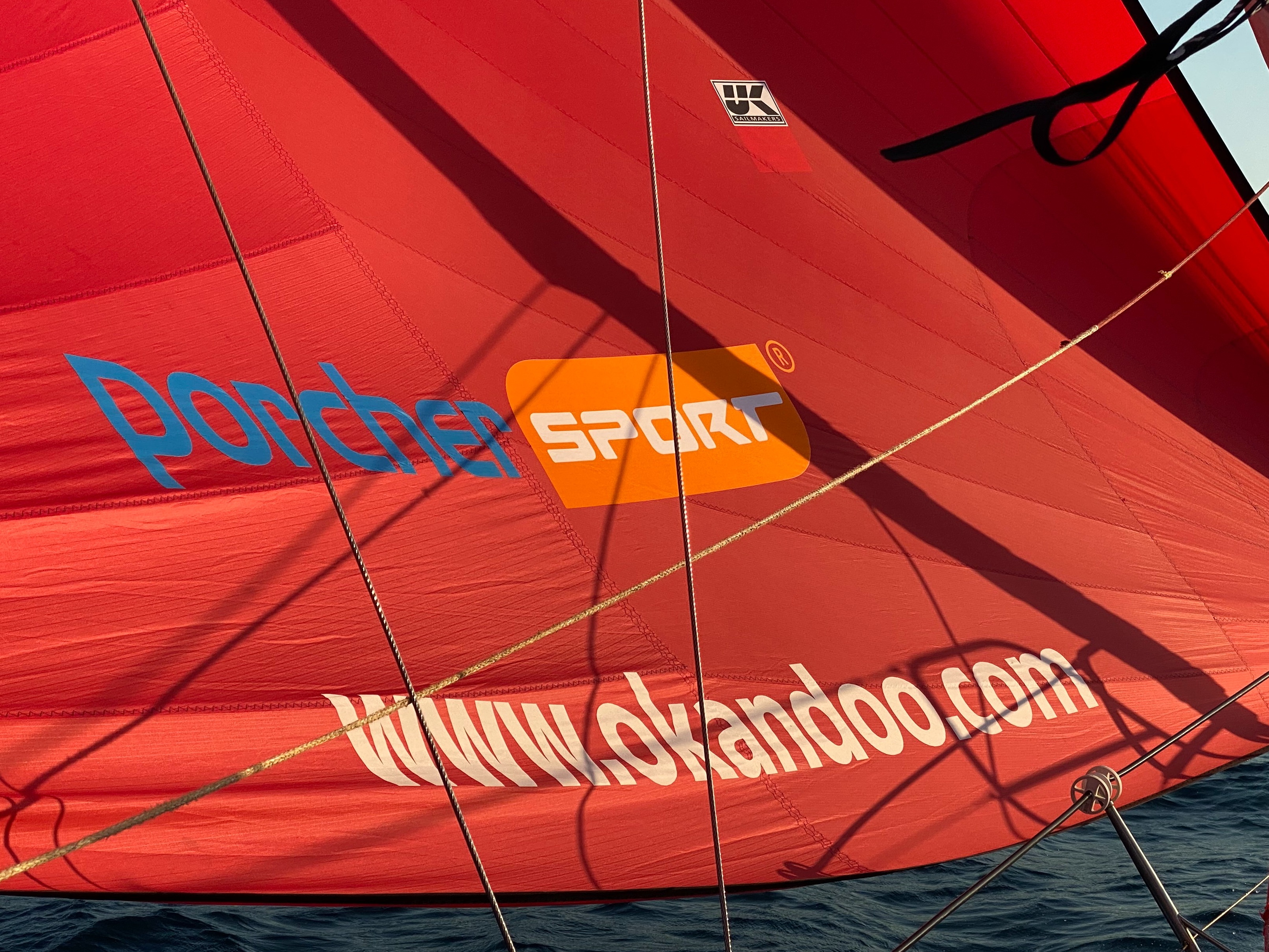 Sail fabric with Okan and Porcher logo and branding