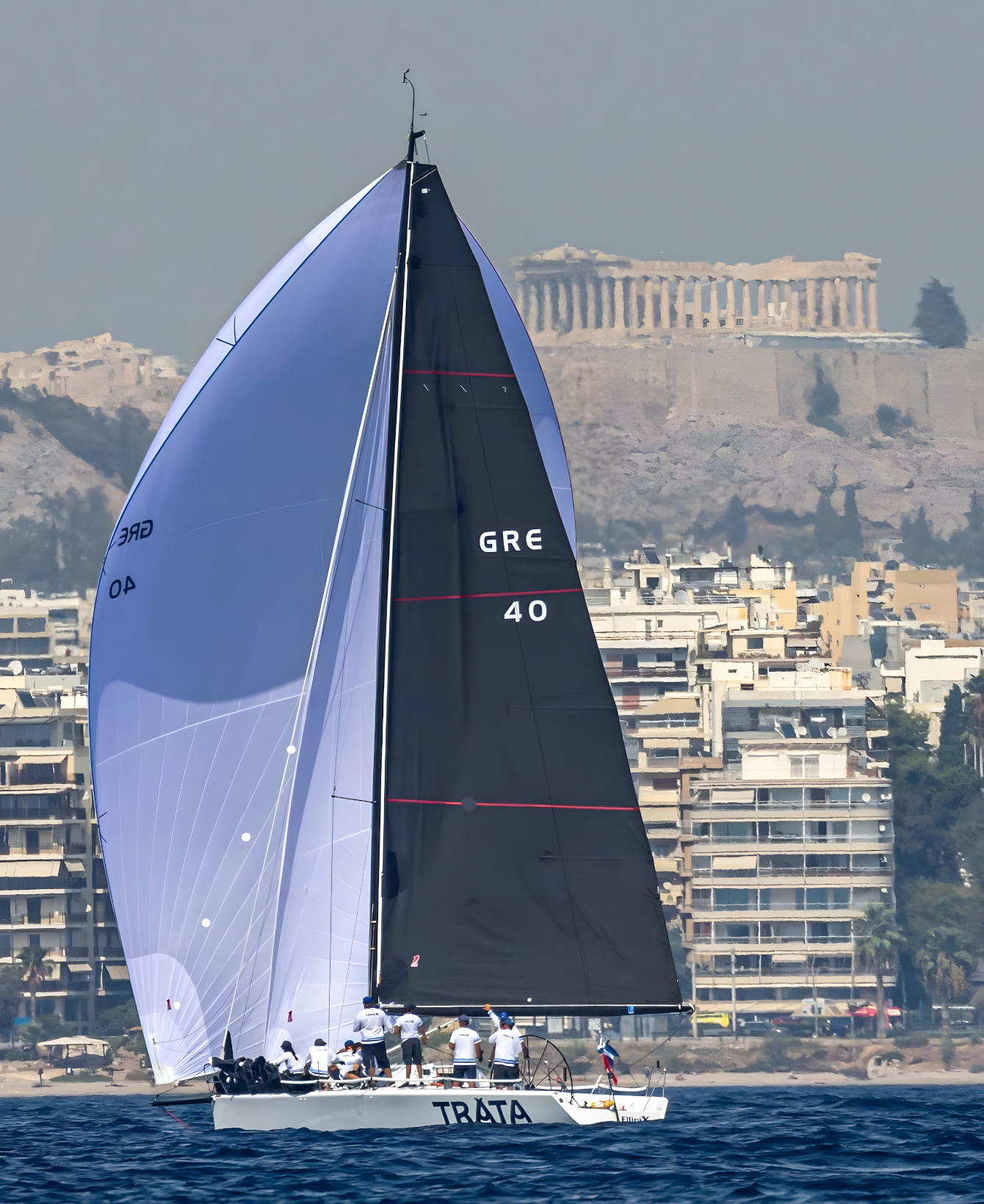 sailing racing boat white spinnaker and black main sails
